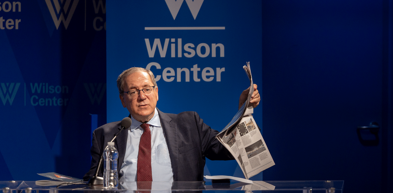 David Sanger holding up a newspaper 