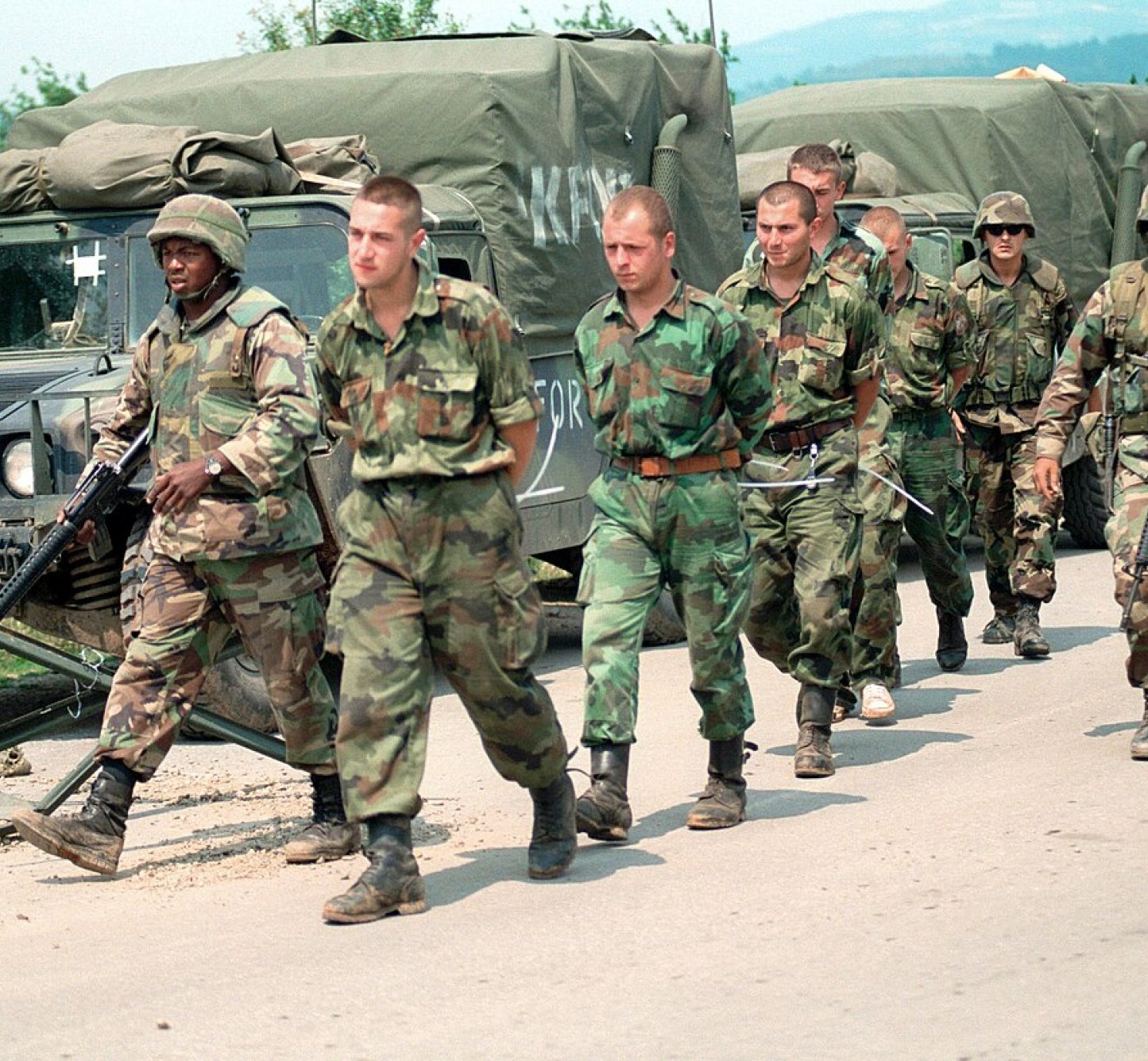 Yugoslav EPWs in Kosovo being escorted by U.S. Marines over to Yugoslav authorities