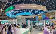 Visitors walking through DEWA Dubai Electricity and water Authority pavilion at 43rd GITEX Global 2023, largest tech and startup event in the world in Dubai, United Arab Emirates - O