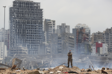 A soldier stands at the devastated site of the explosion in the port of Beirut, Lebanon, 