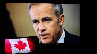 Mark Carney on video screen