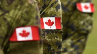Canadian Soldiers with Flags on Arms