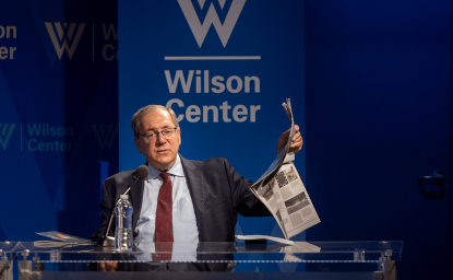 David Sanger holding up a newspaper 