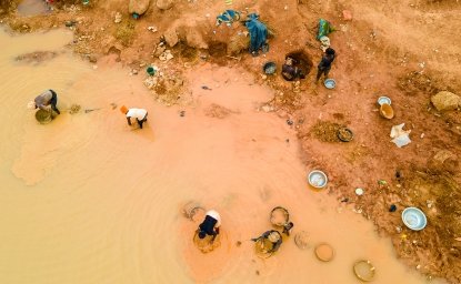 Kunsu, Ghana, March 20, 2023: Rural Women in Small Scale Mining (Galamsey) in Ghana, Africa. The quest for the daily meal of these women relies on them finding gold in an already mined land.