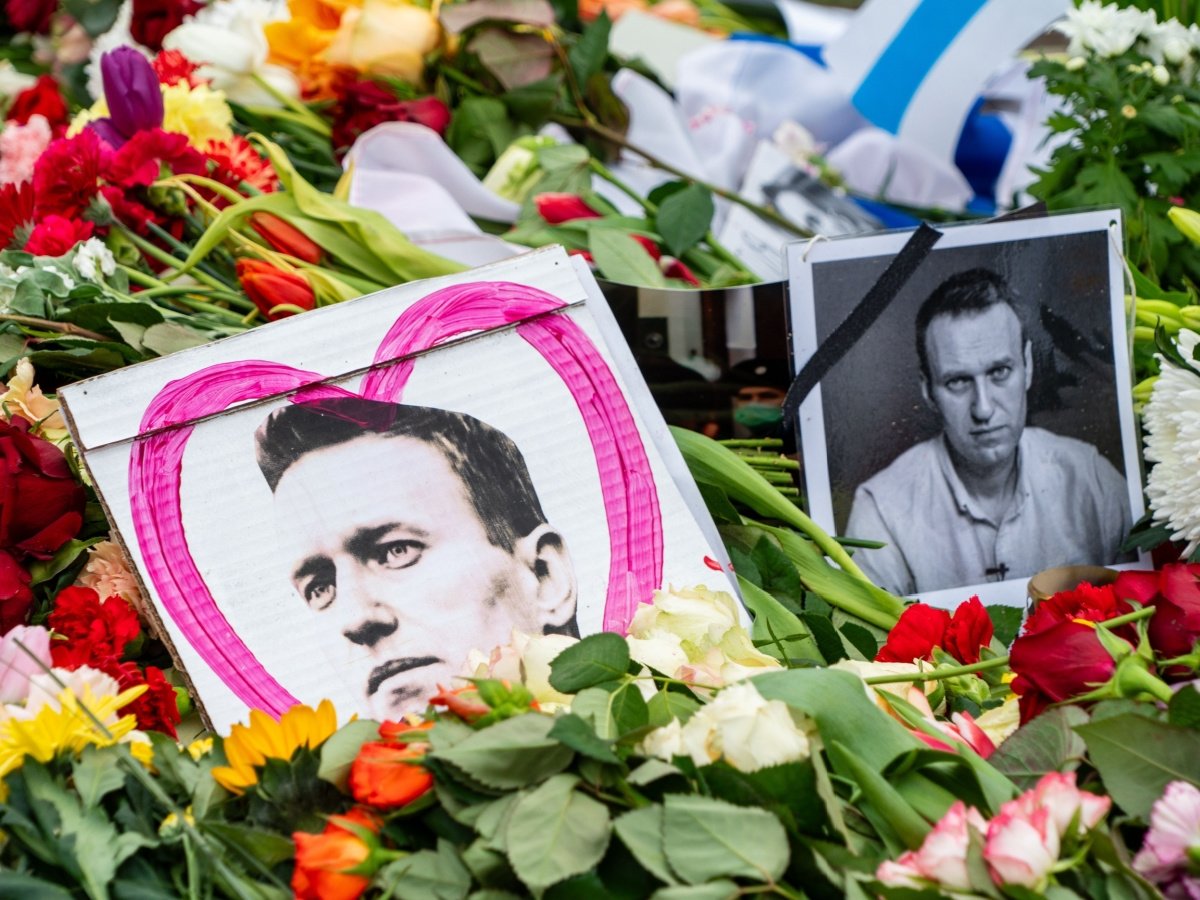 Pictures of Alexei Navalny are seen among flowers at his memorial in Berlin.