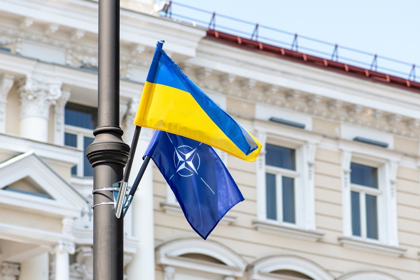 NATO and Ukraine Flags on pole