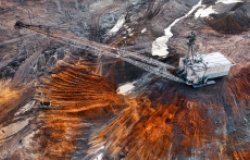 An excavator in a quarry extracting rare minerals.