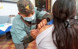 Woman receiving vaccination injection
