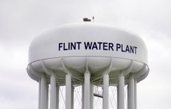 Water tower with "Flint Water Plant" on the side