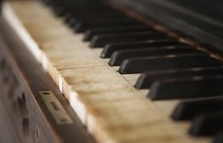 Old piano with faded keys